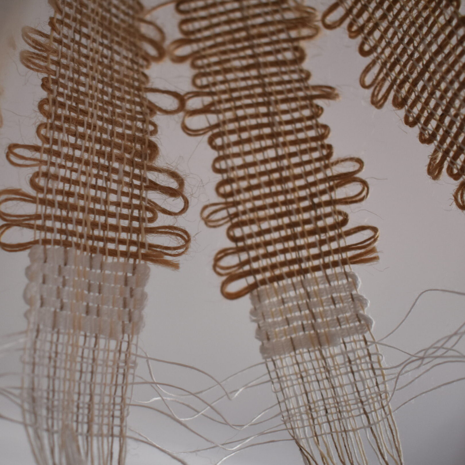 Close up image inside sculptural weave made from jute and linen